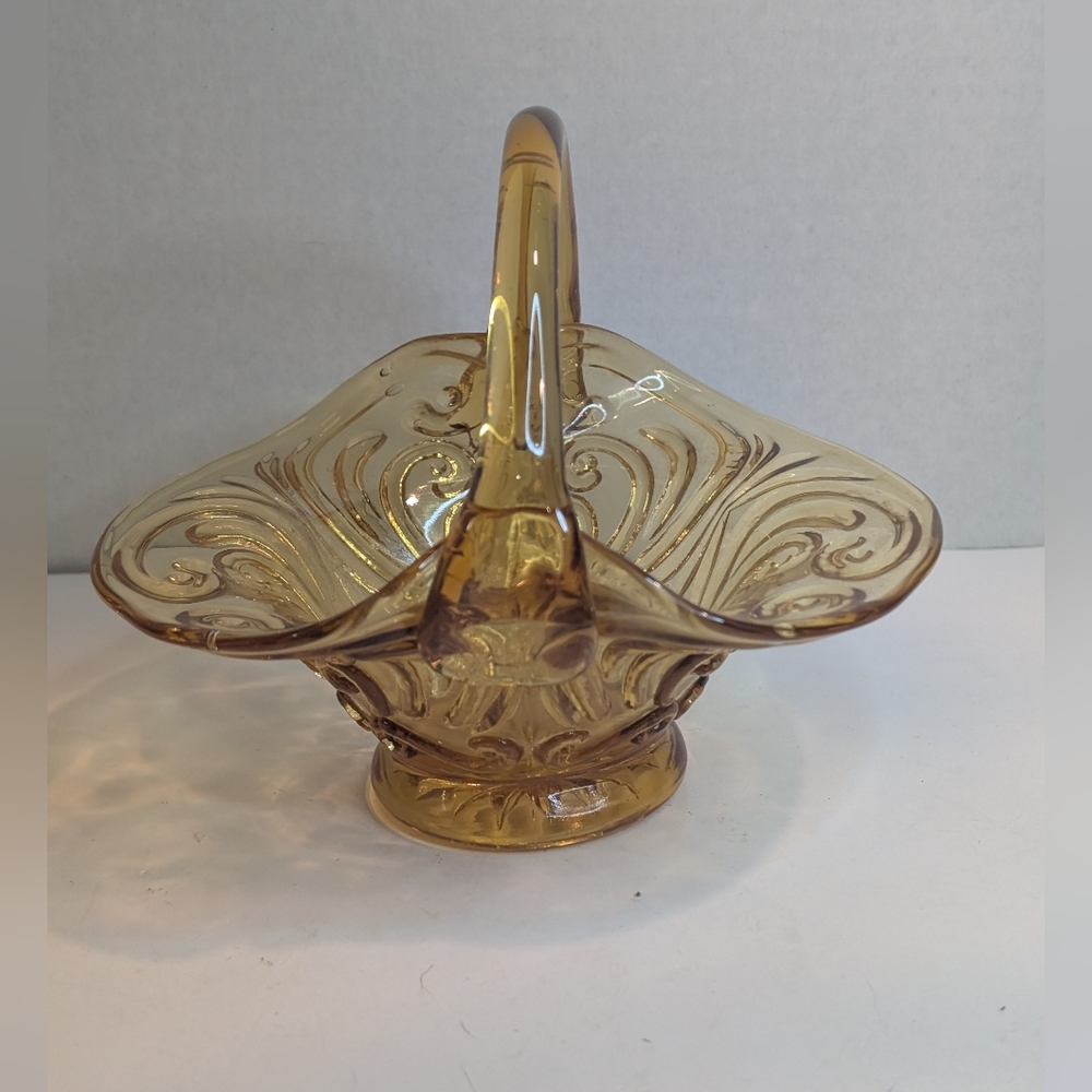 A vintage amber glass basket, likely produced by the Indiana Glass Company